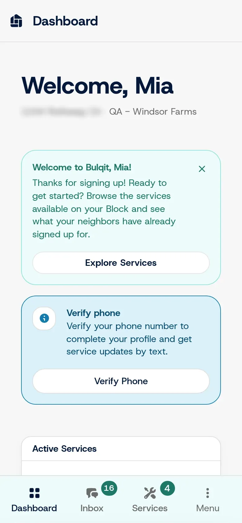 The member dashboard on a phone, welcoming a seeded test member and prompting them to explore services and verify their phone. The address is blurred.